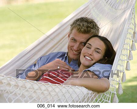 Couple in hammock View Large Photo Image Picture - Couple in hammock. Fotosearch