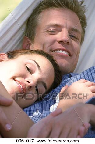 Stock Photo - Couple in hammock. Fotosearch
