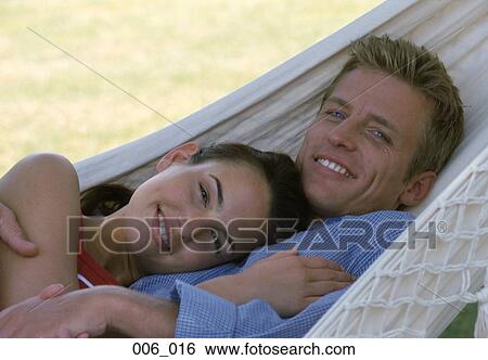 Couple in hammock View Large Photo Image Stock Photograph - Couple in hammock. Fotosearch