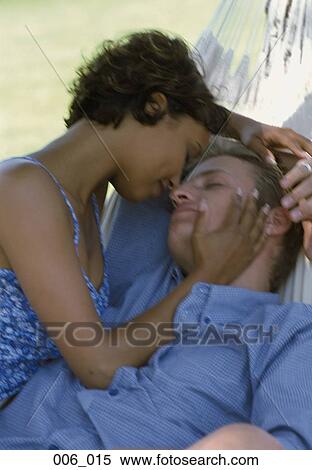 Stock Photography - Couple in hammock. Fotosearch