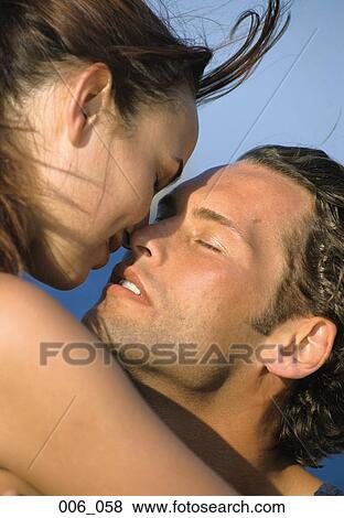 Stock Photo - Couple kissing. Fotosearch
