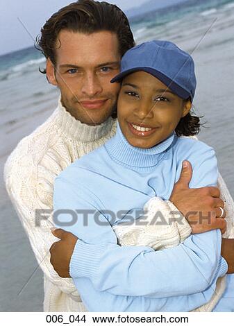 Couple on beach View Large Photo Image Picture - Couple on beach. Fotosearch