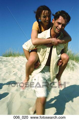 Couple on beach View Large Photo Image Stock Image - Couple on beach. Fotosearch