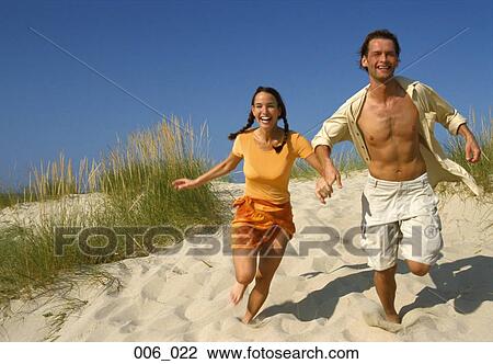 Couple on beach View Large Photo Image Stock Image - Couple on beach. Fotosearch
