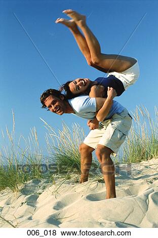 Stock Photo - Couple on beach. Fotosearch