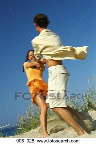 Couple on beach View Large Photo Image Stock Photo - Couple on beach. Fotosearch