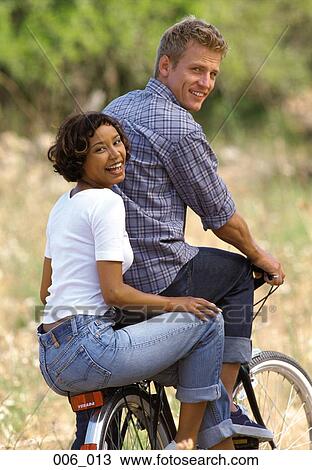 Couple on bicycle View Large Photo Image Stock Image - Couple on bicycle. Fotosearch