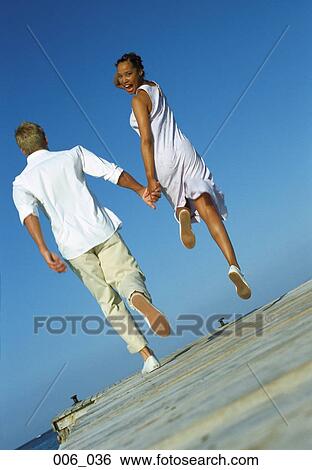 Couple on pier View Large Photo Image Stock Photograph - Couple on pier. Fotosearch