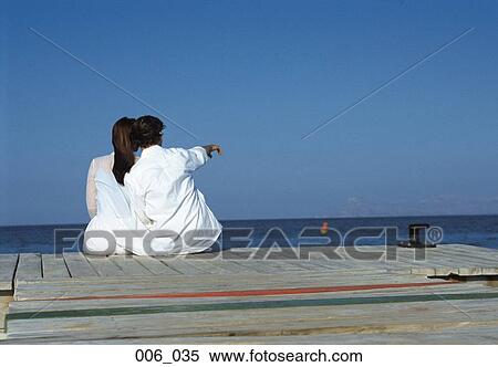 Couple on pier View Large Photo Image Stock Photography - Couple on pier. Fotosearch