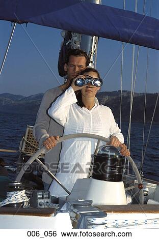 Couple on sailing boat View Large Photo Image Stock Photograph - Couple on sailing boat. Fotosearch