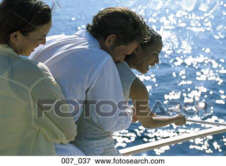 Friends at the seaside View Large Photo Image Stock Photo - Friends at the seaside. Fotosearch