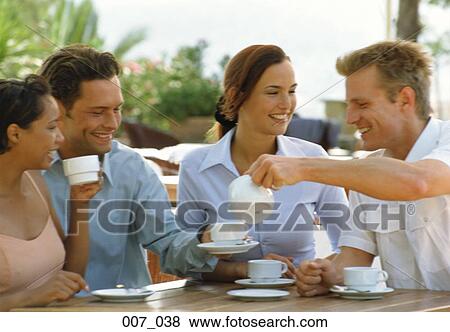 Stock Photo - Friends in a café. Fotosearch