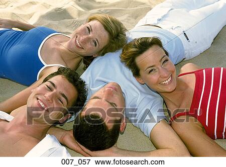 Friends on the beach View Large Photo Image Stock Photo - Friends on the beach. Fotosearch