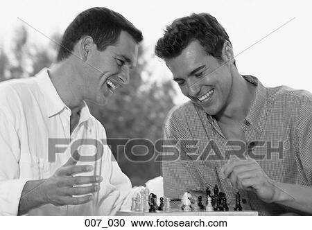 Stock Image - Men playing Chess. Fotosearch