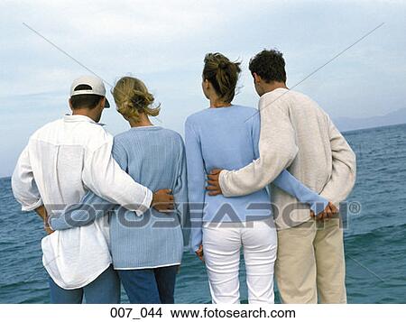Picture - Two couples at the seaside. Fotosearch