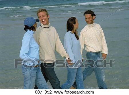 Two couples on the beach View Large Photo Image Stock Image - Two couples on the beach. Fotosearch