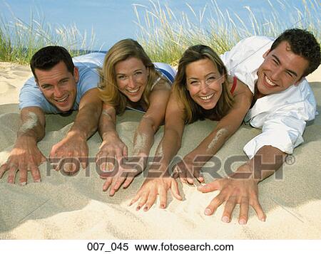 Two couples on the beach View Large Photo Image Stock Photography - Two couples on the beach. Fotosearch