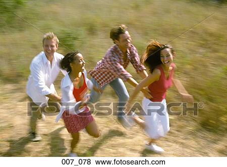Stock Photo - Two couples running. Fotosearch