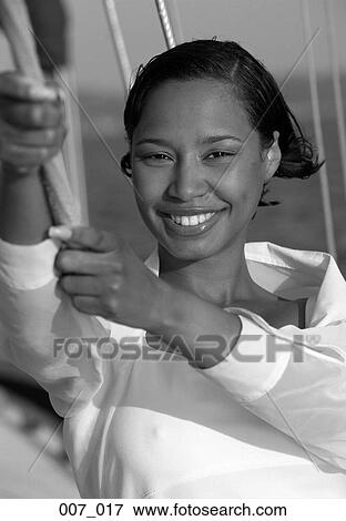 Stock Photo - Woman on sailing boat. Fotosearch