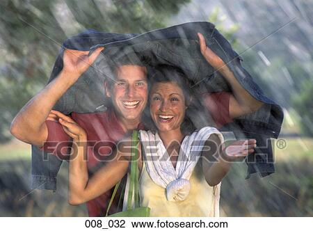 Couple in the rain View Large Photo Image Stock Image - Couple in the rain. Fotosearch