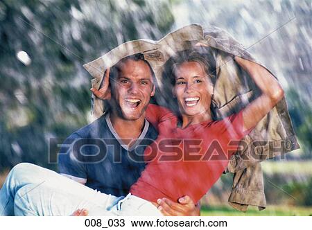 Couple in the rain View Large Photo Image Stock Image - Couple in the rain. Fotosearch