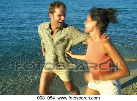 Couple on beach View Large Photo Image Picture - Couple on beach. Fotosearch