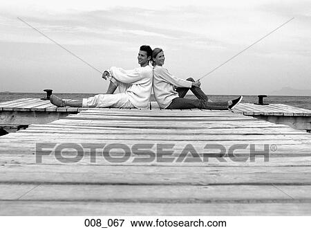 Couple on pier View Large Photo Image Stock Photo - Couple on pier. Fotosearch