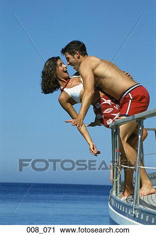 Couple on sailing boat View Large Photo Image Stock Image - Couple on sailing boat. Fotosearch