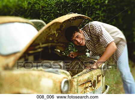 Man repairing car View Large Photo Image Stock Photograph - Man repairing car. Fotosearch