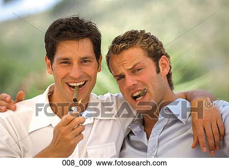 Stock Photo - Men smoking cigars. Fotosearch