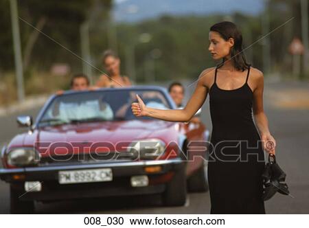 Woman hitch-hiking View Large Photo Image Stock Image - Woman hitch-hiking. Fotosearch