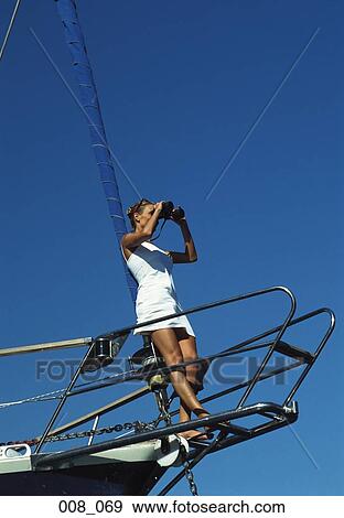 Stock Photo - Woman on sailing boat. Fotosearch