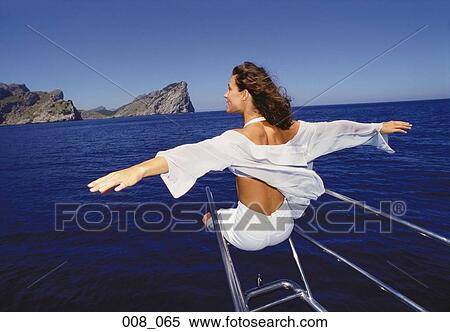 Stock Photography - Woman on sailing boat. Fotosearch