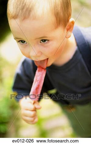 Boy with ice lolly View Large Photo Image Stock Photograph - Boy with ice lolly. Fotosearch
