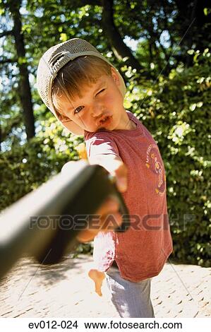 Boy with water pistol View Large Photo Image Picture - Boy with water pistol. Fotosearch