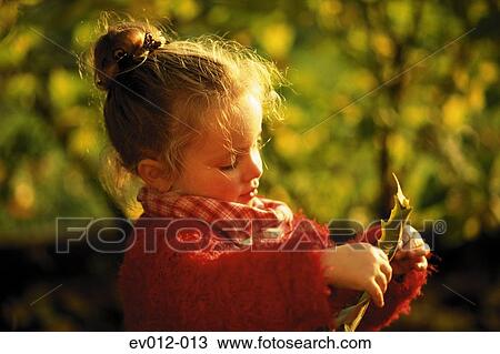Girl with autumn leaf View Large Photo Image Stock Image - Girl with autumn leaf. Fotosearch