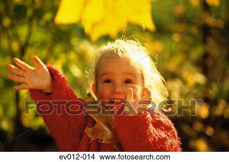 Picture - Girl with autumn leaves. Fotosearch