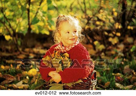 Girl with autumn leaves View Large Photo Image Stock Image - Girl with autumn leaves. Fotosearch
