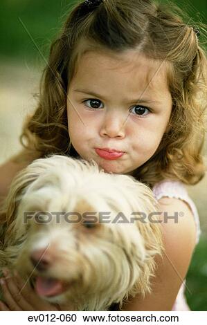 Stock Image - Girl with dog. Fotosearch