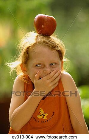 Girl with apple View Large Photo Image Picture - Girl with apple. Fotosearch