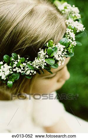 Stock Image - Girl with flower coronet. Fotosearch