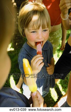 Girl with ice lolly View Large Photo Image Stock Photo - Girl with ice lolly. Fotosearch