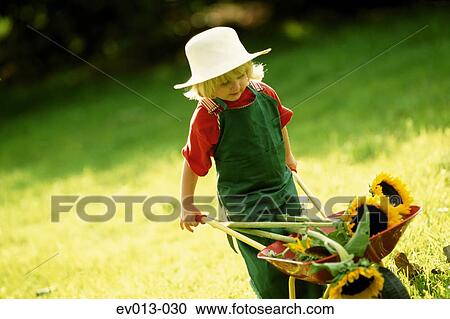 Stock Image - Girl with sunflowers. Fotosearch