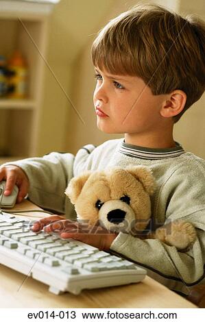 Stock Image - Boy at computer. Fotosearch