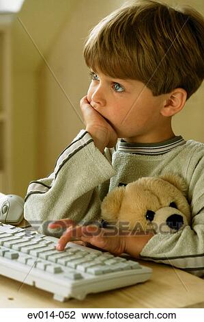 Boy at computer View Large Photo Image Stock Image - Boy at computer. Fotosearch