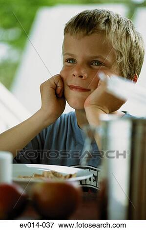 Boy having breakfast View Large Photo Image Stock Photo - Boy having breakfast. Fotosearch