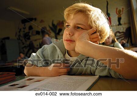 Stock Image - Boy in class. Fotosearch