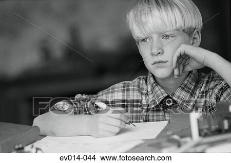 Picture - Boy studying. Fotosearch