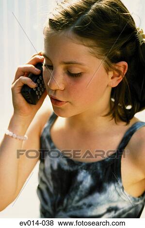 Stock Photo - Girl on mobile phone. Fotosearch