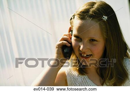 Girl on mobile phone View Large Photo Image Stock Photo - Girl on mobile phone. Fotosearch